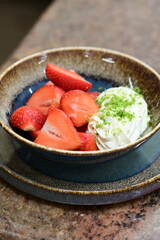 Fresh strawberries served with whipped cream and mascarpone cheese – a simple yet elegant dessert with creamy texture and vibrant colors