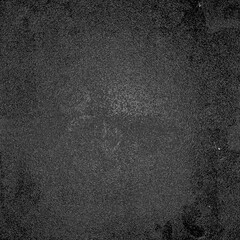 Dark grainy texture creating abstract background with vignette effect