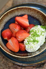Fresh strawberries served with whipped cream and mascarpone cheese – a simple yet elegant dessert with creamy texture and vibrant colors