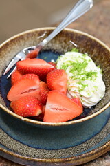 Fresh strawberries served with whipped cream and mascarpone cheese – a simple yet elegant dessert with creamy texture and vibrant colors