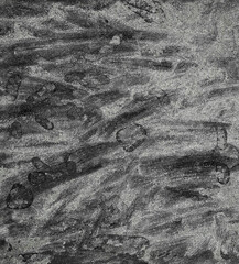 Abstract gray background showing chalkboard texture with smudged writing