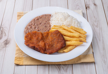 Milanese beef, rice, beans and french fries. Typical brazilian executive dish