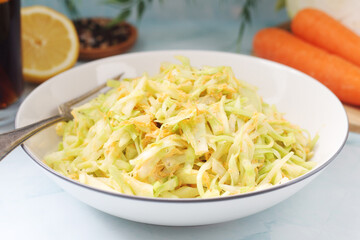 A bowl with coleslow salad	