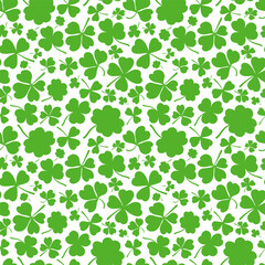 Shamrock or clover leaf flat design green seamless pattern falling leaves on white background vector illustration. Irish holiday celtic St Patrick day motif seamless pattern with shamrock clover leaf.