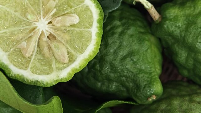 Fresh Kaffir Lime Rotating on Wooden.