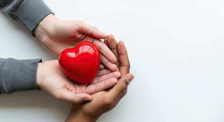 Gentle hands sharing a vibrant red heart symbolizing love care and compassion