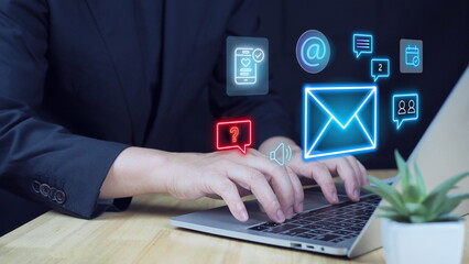 Digital marketer using email marketing tools on laptop sending newsletters and analyzing campaign performance to engage subscribers, email marketing campaign in a modern, well-lit office