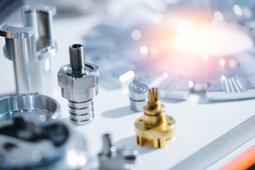 Close-up of cnc machined metal parts on industrial surface