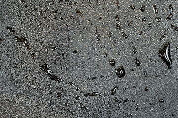 Water droplets on a cast iron macro surface. Cast iron cookware care, rust resistant, abstract...