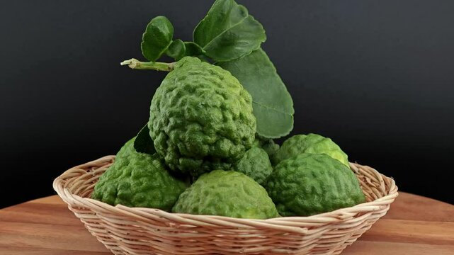 Fresh Kaffir Lime Rotating on Wooden.