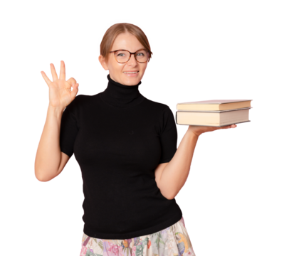 Photo of young beautiful smiling positive cheerful girl in glasses with pile of books on transparent background. PNG transparent