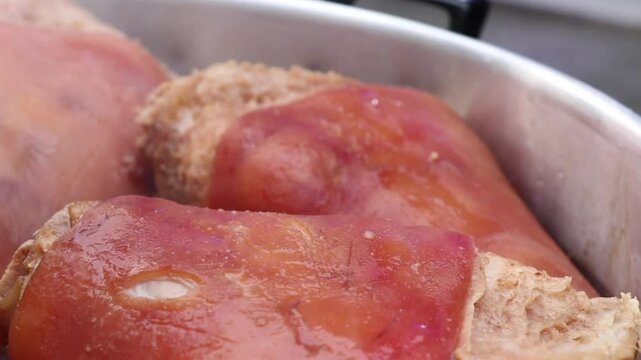 Boiling pork hocks in a pot