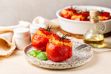 Mediterranean dinner. Baked stuffed tomatoes with rice, cheese and basil. Copy space.