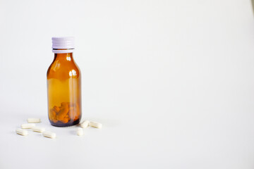 brown glass bottle for supplement product isolated on white background with clipping path