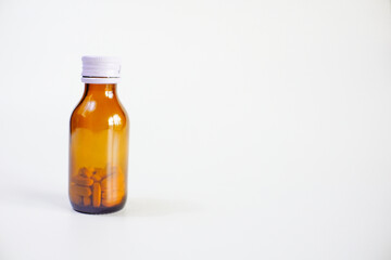 brown glass bottle for supplement product isolated on white background with clipping path