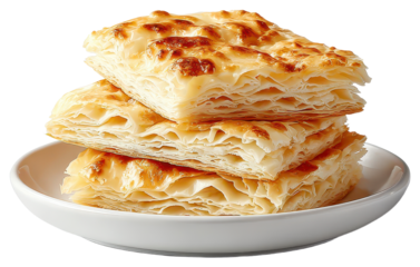 Delicious bosnian burek isolated on a white background showcasing its flaky pastry and savory filling in detail