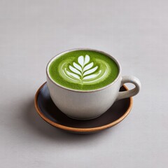 Matcha latte milk natural light concept. A beautifully crafted cup of matcha latte with intricate latte art on a saucer.