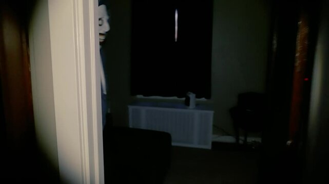 A terrifying intruder zombie in a hoodie charges down a hallway, reaching for the camera with glowing eyes and a twisted grin. Intense POV horror chase scene inside a dark home.  	