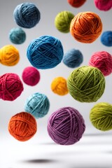 Colorful yarn balls floating in mid-air