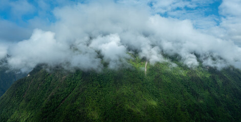 Aerial view of  beautiful foggy forest mountain landscape