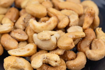 background of organic cashew nuts, roasted salted cashew for snack, healthy eating, delicious breakfasts