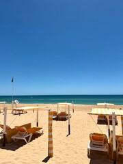 beach chairs and umbrellas