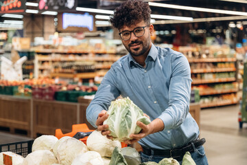 Front view. Man is in the grocery store
