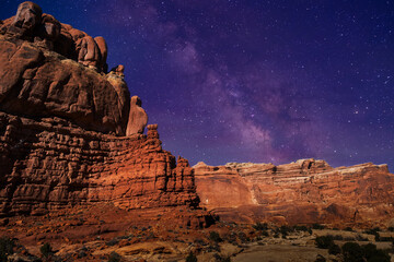 Starry sky over mountains at night with Milky Way
