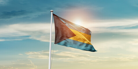 The Bahamas national flag waving in the sky with mast. 