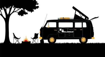 Vintage camper van with pop-up roof by a campfire in nature  