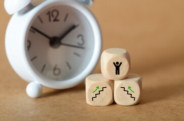 Wooden Dice Climbing Success Steps with Raised Arms – Concept of Strategy, Growth, and Victory