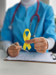 Suicide prevention day and sarcoma, bone, bladder and childhood cancer awareness month. Yellow...