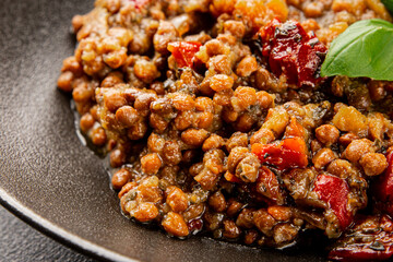 Lentil dish vegetables and roasted peppers savory vegetable fresh vegetarian and vegan food gourmet food background on the table rustic food top view copy space keto and paleo diet