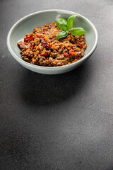 Lentil dish vegetables and roasted peppers savory vegetable fresh vegetarian and vegan food gourmet food background on the table rustic food top view copy space keto and paleo diet
