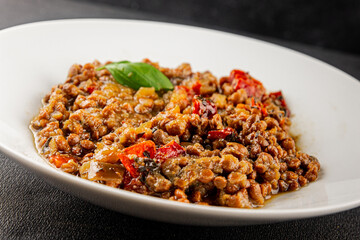 Lentil dish vegetables and roasted peppers savory vegetable fresh vegetarian and vegan food gourmet food background on the table rustic food top view copy space keto and paleo diet