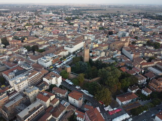 Obraz premium Aerial drone view of Rovigo city center, Veneto, showcasing the medieval Donà Tower, ancient castle ruins, and a mix of historic and modern buildings.