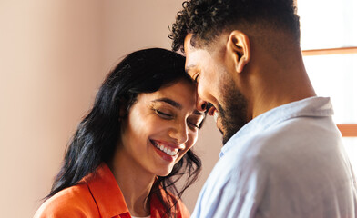 Fototapeta na wymiar Loving Latino couple sharing a tender moment of joy and connection