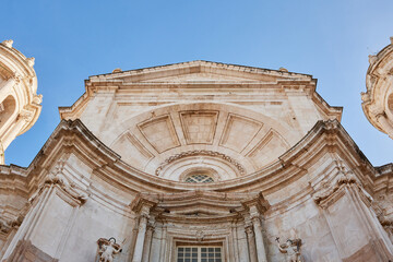 Baroque architectural details on the upper façade of the Cathedral of Cadiz, Spain