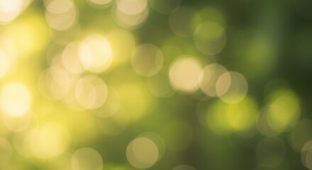 Obraz premium Abstract of blurred green and golden bokeh lights, creating a dreamy, soft atmosphere