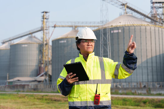 Engineers are checking the working system of a fresh food factory producing ducks, chickens and pork outside the building.