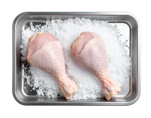 Fototapeta premium raw chicken drumsticks placed on crushed ice in stainless steel tray for food preservation and freshness on isolated background 