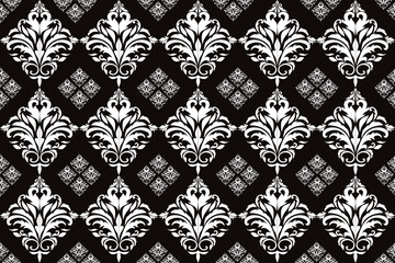 Fototapeta premium This design features a traditional Thai textile pattern with symmetrical, intricate motifs in a repeating layout, commonly seen in woven fabrics from Thailand.