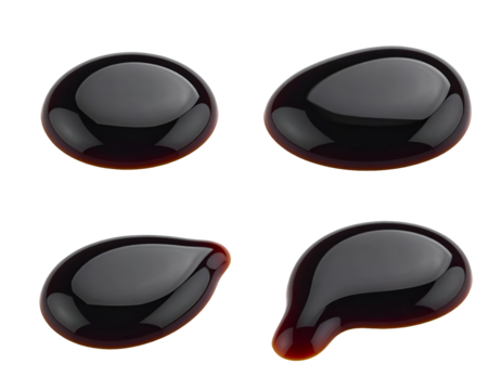 set of 4 black soy sauce drops with smooth round shapes and realistic glossy texture on isolated background
