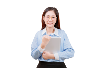 Asian young beautiful woman in glasses and a striped shirt smiles confidently while holding a laptop and making a fist gesture.