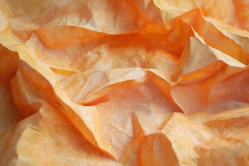 Abstract Orange Crepe Paper Texture Background for Design Projects, Offering a Unique and Artistic Wrinkled Surface