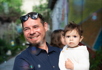 young happy dad with little girl