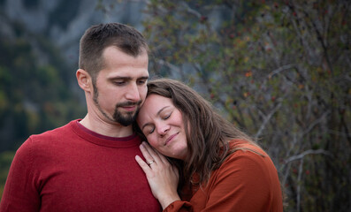 happy young couple posing outdoors in autumn