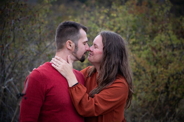 happy young couple posing outdoors in autumn