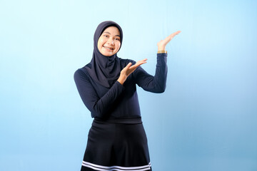 A woman wearing a black skirt and a black head scarf