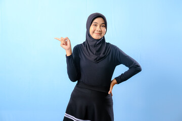A woman wearing a black skirt and a black head scarf